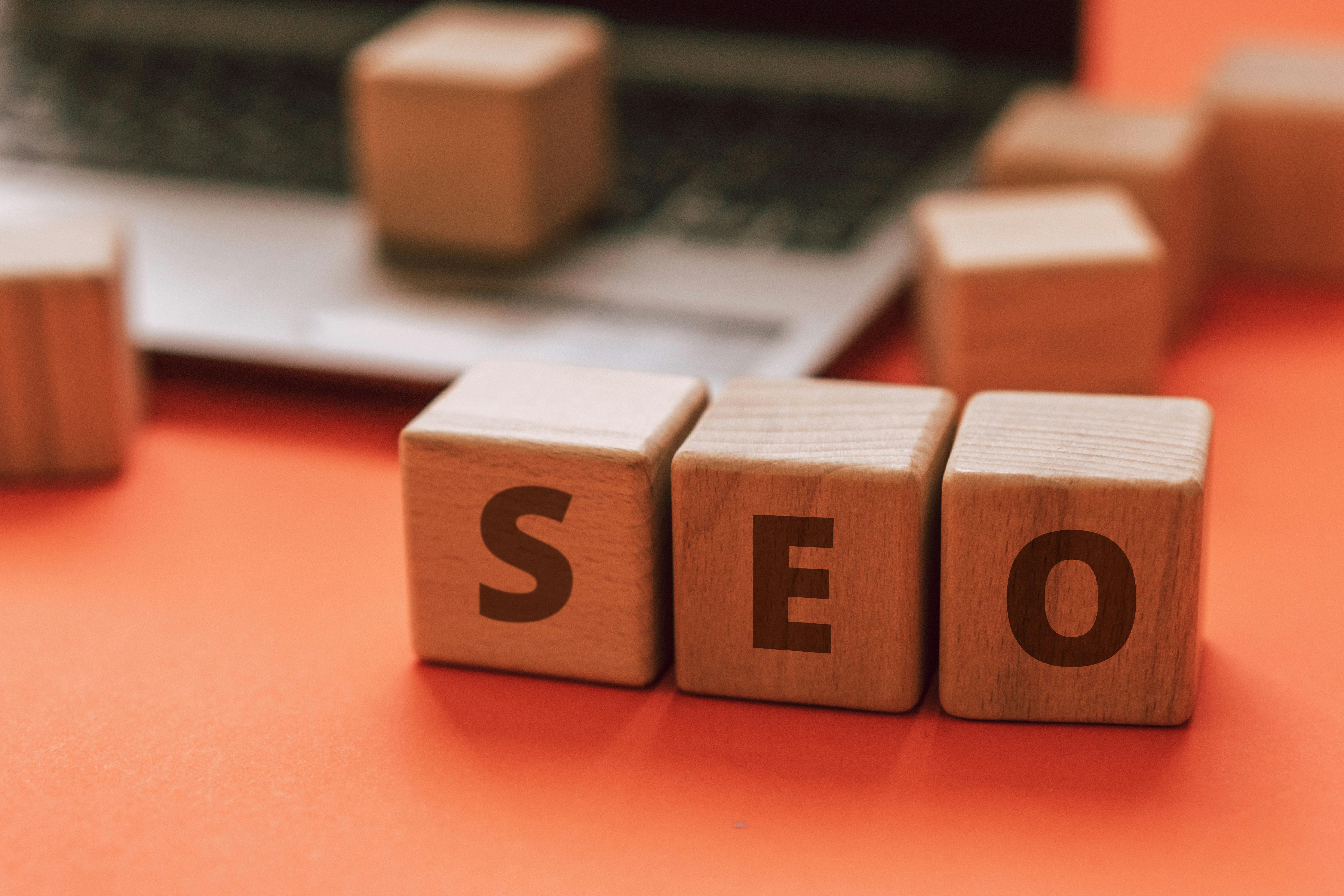 Laptop with search and website analytics visuals, representing SEO execution.