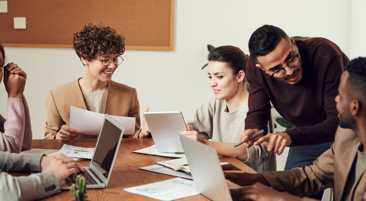 Business partners collaborating at a desk, representing channel co-marketing.